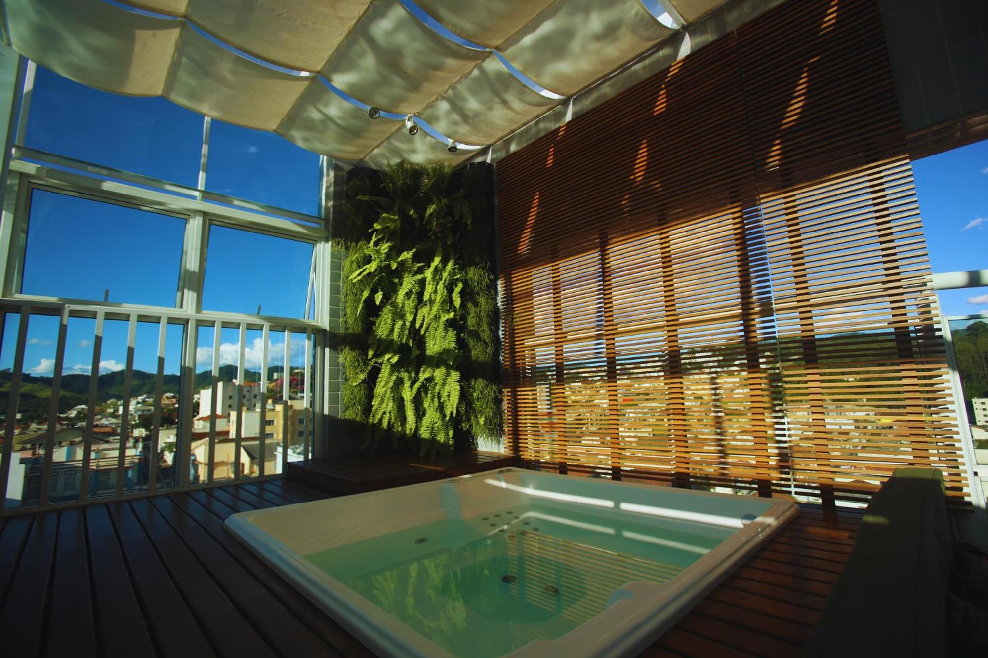 Gontijo Inn Hotel Итажуба Экстерьер фото A rooftop spa